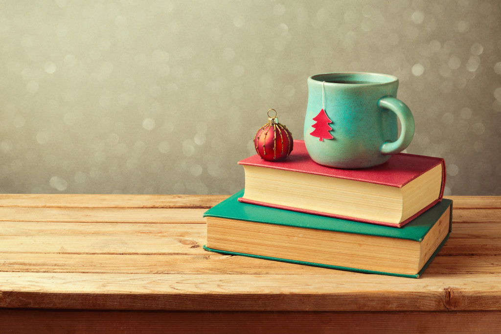 Christmas tea cup and ball on vintage books